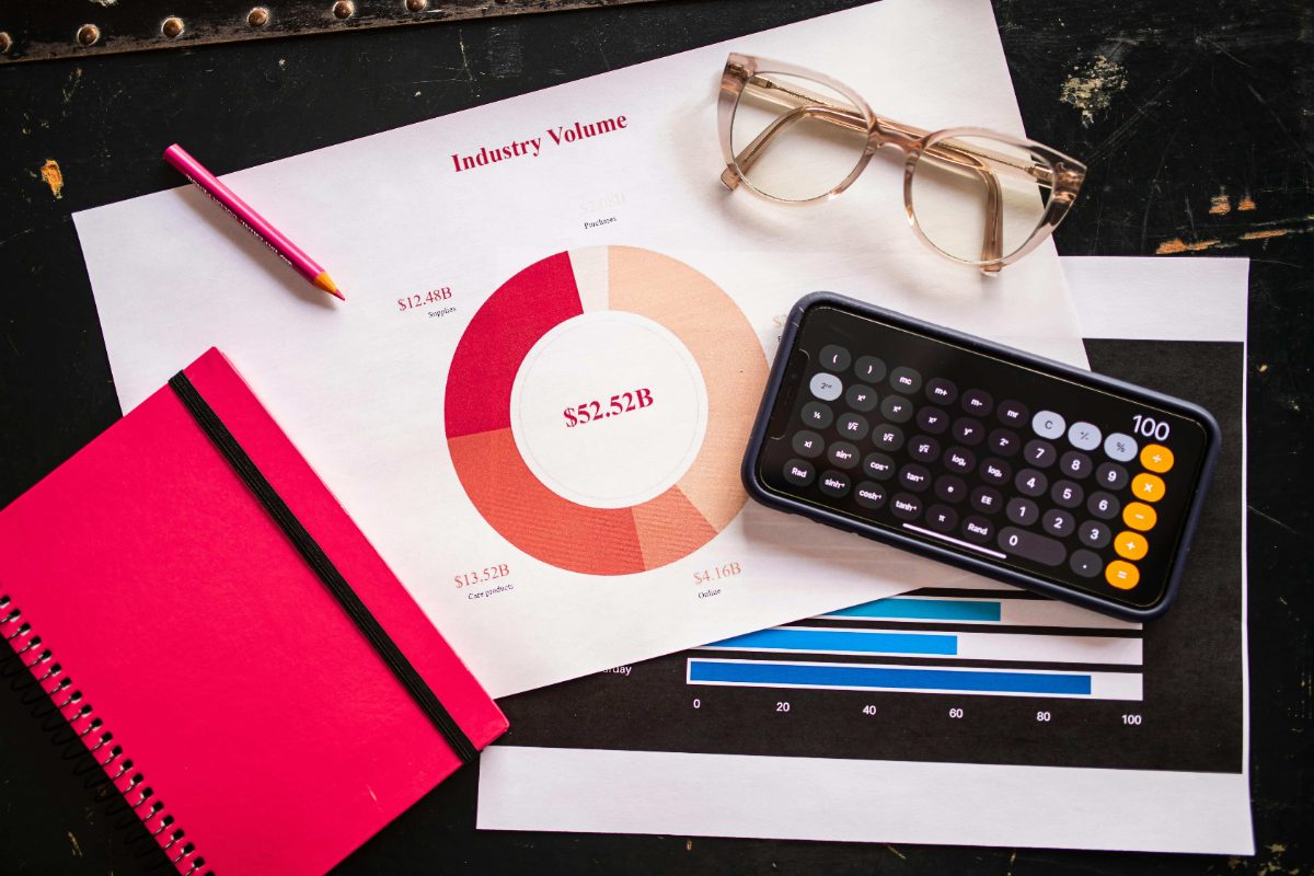 Revenue report with a donut chart, calculator, and glasses